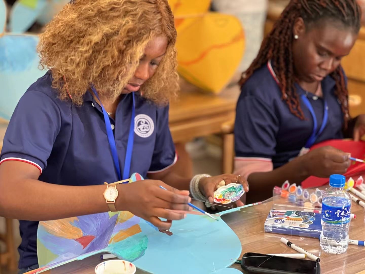 People painting or engaging in activity